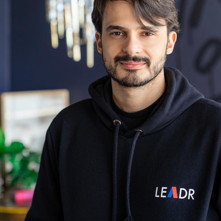 Mateo Chen, Client Relations Director, discussing corporate gifting strategy with business clients